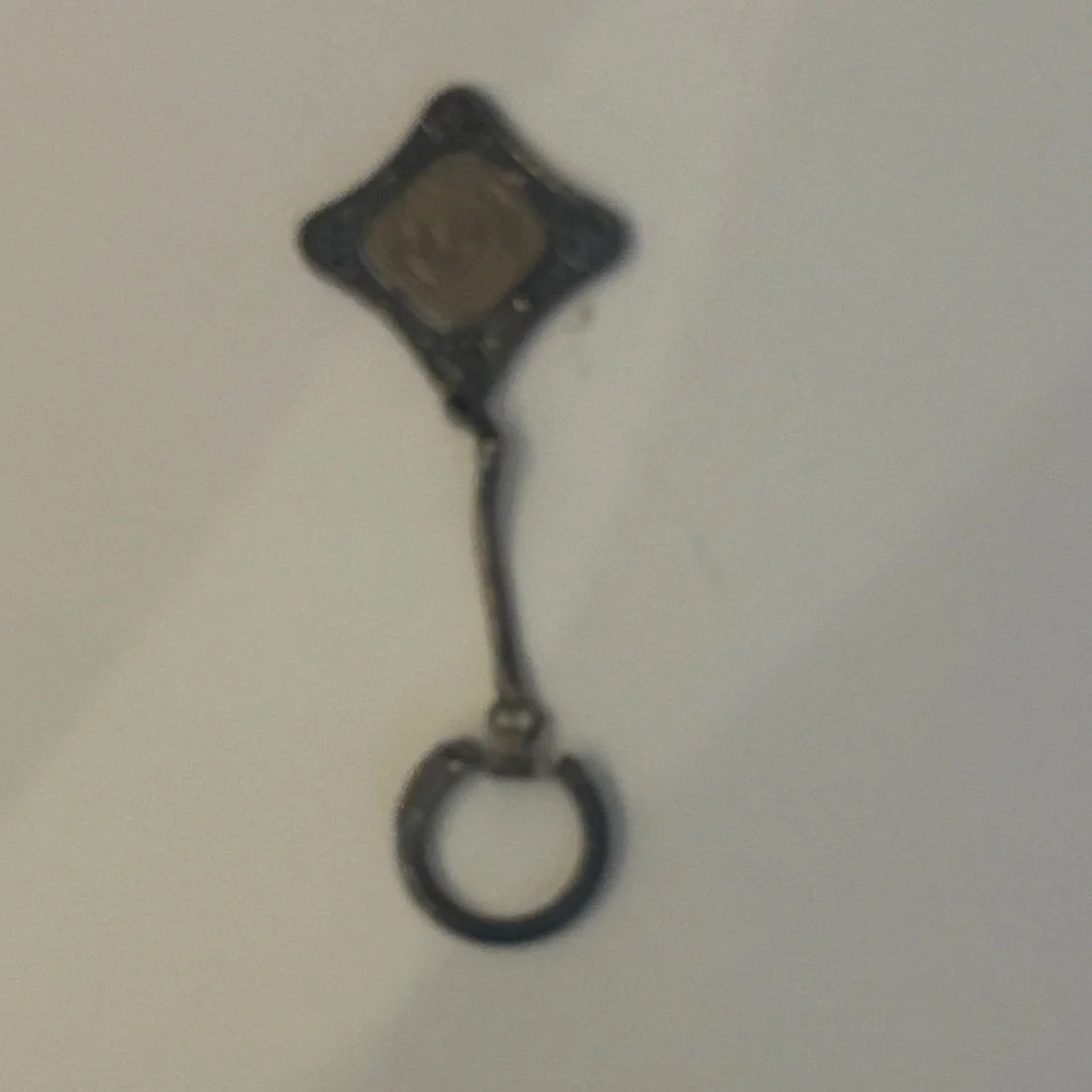 Key Chain featuring a 1943 Curaçao 5 cents coin set in a metal holder